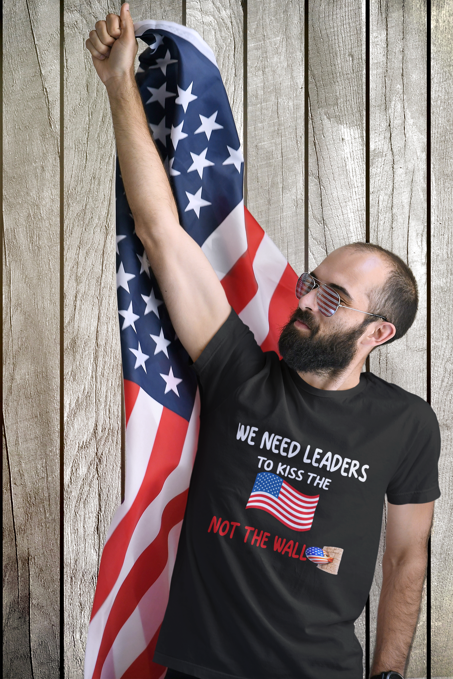 WE NEED LEADERS to kiss the FLAG not the wall  T-Shirt